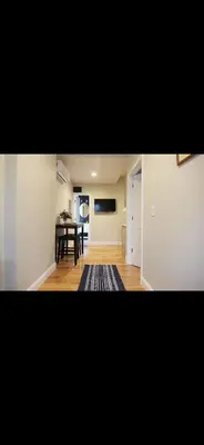 a living room with a table and a dining room at Fresh&Quiet one bedroom Apartment in University City near Drexel&UPenn in Philadelphia