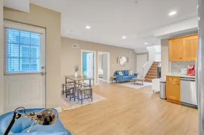 a kitchen and living room with a table and chairs at Huge 5 bedroom in Center City Philadelphia in Philadelphia
