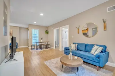 a living room with a blue couch and a table at Huge 5 bedroom in Center City Philadelphia in Philadelphia