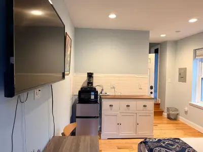 a kitchen with a sink and a counter top at Sunny&Cozy Apartment in University City near Drexel&UPenn in Philadelphia