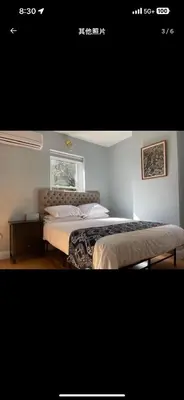 a bedroom with two beds and a window at Sunny&Cozy Apartment in University City near Drexel&UPenn in Philadelphia