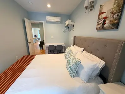 a bedroom with a bed with two pillows on it at Super Cozy two bedrooms Apartment in University City near Drexel&UPenn in Philadelphia