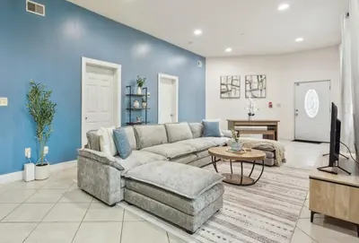 a living room with a couch and a table at Cozy 3 bedroom in Center City Philadelphia in Philadelphia