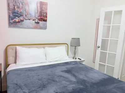 a bedroom with a bed and a painting on the wall at The W50 Metropolitan in New York