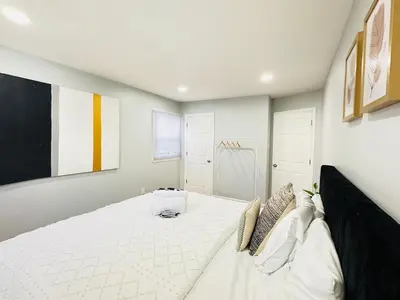 a bedroom with a large white bed in a room at Lux NYC Stay 3Bed2Bath w parking in Jersey City