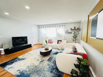 a living room with two couches and a tv at Lux NYC Stay 3Bed2Bath w parking in Jersey City