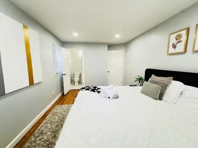 a bedroom with a large white bed in a room at Lux NYC Stay 3Bed2Bath w parking in Jersey City