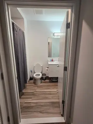 a bathroom with a toilet and a sink at Luxury Northern Liberties Living in Philadelphia