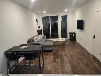 a living room with a couch and a table at Luxury Northern Liberties Living in Philadelphia