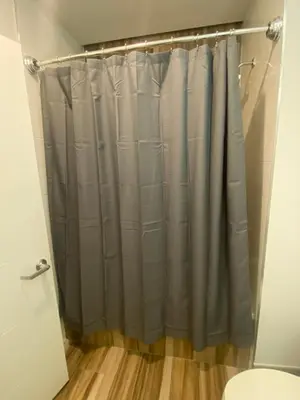 a shower curtain in a bathroom with a toilet at Luxury Northern Liberties Living in Philadelphia