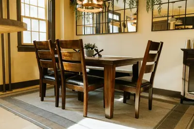a dining room with a wooden table and chairs at The Ashfield House - Close to Downtown Lancaster in Lancaster