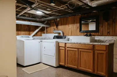a kitchen with white appliances and a sink at The Ashfield House - Close to Downtown Lancaster in Lancaster