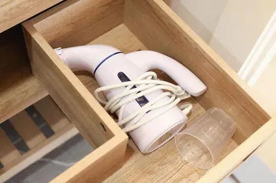 a wooden box with a blow dryer and a glass at Excellence by Urooms Apartments Near NYC and Newark Airport with Parking in Elizabeth