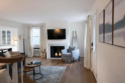 a living room with a couch and a fireplace at Lakefront House 30 Min to NYC & MetLife Stadium