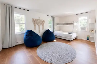 a living room with two large blue bean bags at Lakefront House 30 Min to NYC & MetLife Stadium