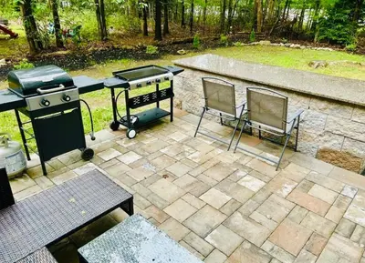 an aerial view of a patio with a grill and two chairs at LUX Poconos Home MINS to Lehigh Valley Hosp in Pocono Summit