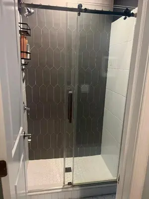 a shower with a glass door in a bathroom at Spacious one bedroom Apartment in University City near Drexel&UPenn in Philadelphia
