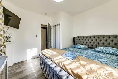a bedroom with a large bed in a room at Walk to Shops, Parks and Restaurants Teaneck Escape in Teaneck