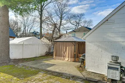 a backyard with a gazebo next to a house at Walk to Shops, Parks and Restaurants Teaneck Escape in Teaneck
