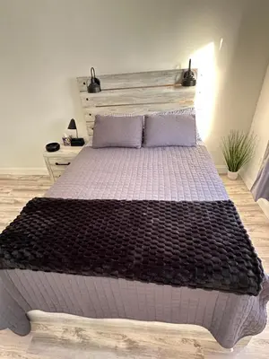 a bedroom with a large bed with two pillows at Beautiful and comfortable room, close to New York Hermosa y cómoda habitación, cerca a New York in West New York