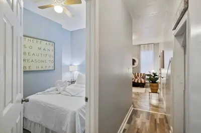 a bedroom with a bed and a ceiling fan at Renovated 2BR w Amenities in Philadelphia