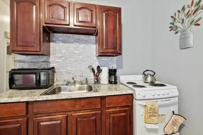 a kitchen with a sink and a stove at Renovated 2BR w Amenities in Philadelphia