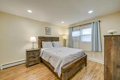 a bedroom with a large bed and a window at Walkable Jersey City Stay Near Parks and Dining! in Jersey City