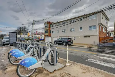 two bikes are parked on the side of a street at Walk to Lincoln Park Jersey City Commuter Apt! in Jersey City