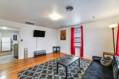 a living room with a couch and a table at Work and Study Binghamton Apt 2 Mi to Downtown in Binghamton