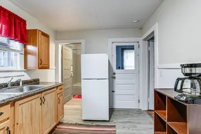 a kitchen with a white refrigerator and a sink at Work and Study Binghamton Apt 2 Mi to Downtown in Binghamton