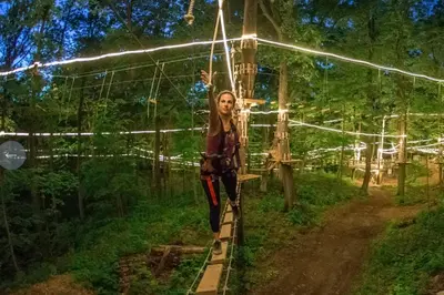 a person standing on a train track with lights at Private 10 guest Getaway Fire-Pit Golf Hike Ski Spa in Vernon