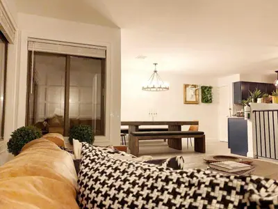 a living room with a couch and a table at Luxe 10 guest Ski Cabin - Snowboarding Hiking Pools Golf Tennis in Vernon Township