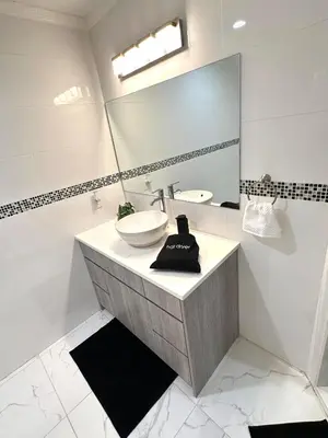 a bathroom with a sink and a mirror at Luxury escape near New York City in Weehawken