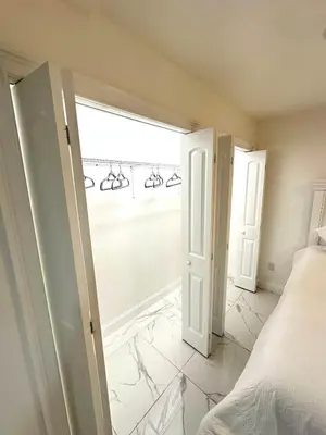 a bedroom with a bed and a window at Luxury escape near New York City in Weehawken