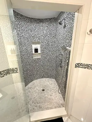 a bathroom with a shower with a glass door at Luxury escape near New York City in Weehawken