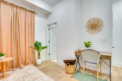 a room with a desk and a chair at 5 Mi to NYC Bright and Chic Jersey City Getaway! in Jersey City