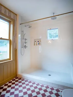 a bathroom with a shower and a checkered floor at LaValleyEstates in Long Eddy