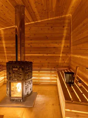 a wooden room with an outdoor stove in a sauna at LaValleyEstates in Long Eddy