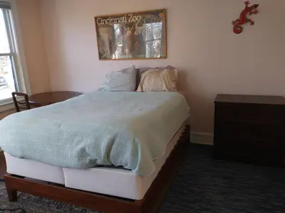 a bedroom with a bed with a comforter on it at 3 Bedroom Apartment 30 Minutes to New York No Car Needed in Ridgefield Park