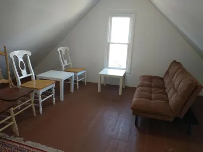 a living room with a couch and chairs at 3 Bedroom Apartment 30 Minutes to New York No Car Needed in Ridgefield Park