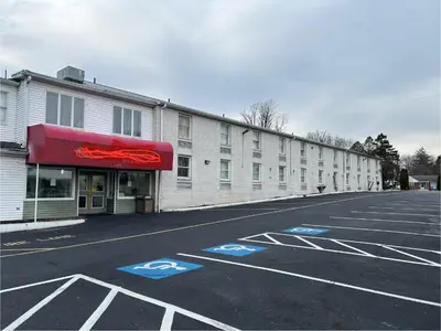 an empty parking lot in front of a building at Economy Inn of Reading in Reading