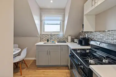 a kitchen with a stove and a sink at Modern 2BR Near NYC with Free Parking and Workspace in East Orange