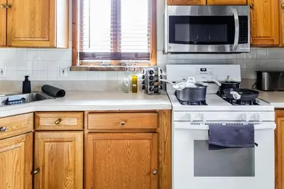 a kitchen with a stove and a microwave at Charming 2 Bedroom Apartment Near NYC, Metlife Stadium in Hackensack