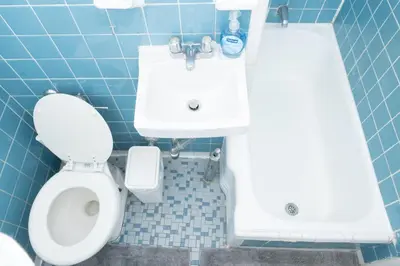 a bathroom with a toilet and a sink at Elegant84 West Side Home 5 min to Central Park in New York