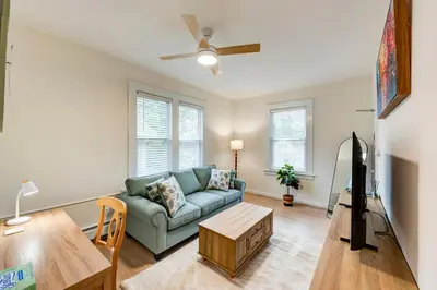 a living room with a couch and a table at Serene Hamilton ELM 13MI to Time Square Laundry Easy Parking in Teaneck