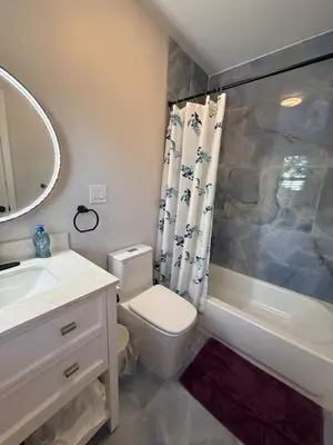 a bathroom with a sink and a toilet and a shower at Spacious private room in a new house with private bathroom close to center city in Philadelphia