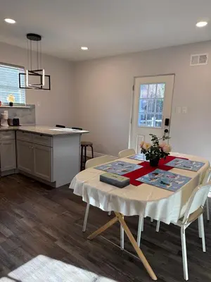 a kitchen and dining room with a table and a counter at Spacious private room in a new house with private bathroom close to center city in Philadelphia