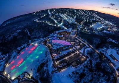 an aerial view of a city at night at Moonlight Mountain Lodge on Camelback Mountain! in Tannersville