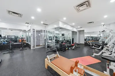 a gym with several treadmills and machines at The Aurora in New York