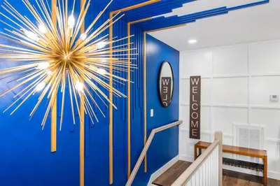 a lobby with a blue wall with a large starburst at Apartment in Irvington Unit B in Irvington